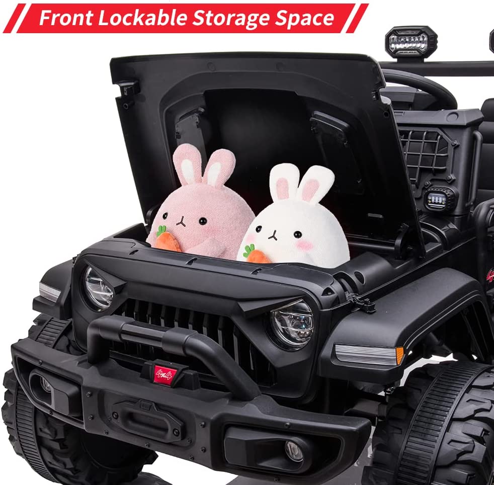 The Black 24V/2WD Xtreme Edition Ride-on Truck features EVA wheels, leather seats, and showcases plush bunnies under the open hood. With a detailed front grille and a banner reading Front Lockable Storage Space, this adventure-packed 2-seater truck is perfect for young drivers.