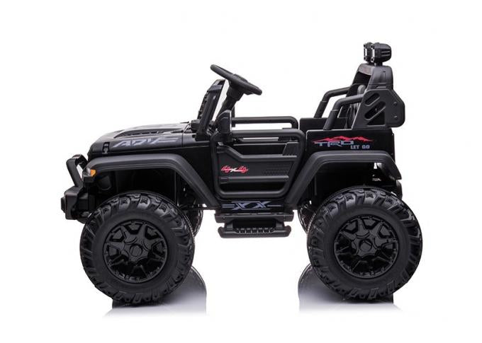 This Kids Ride-On Truck is designed like an off-road vehicle with large tires, red and white decals, a steering wheel, and a roll cage-like top bar. Modeled after the Black 24V/2WD Xtreme Edition with EVA wheels and leather seats, its perfect for adventure seekers.