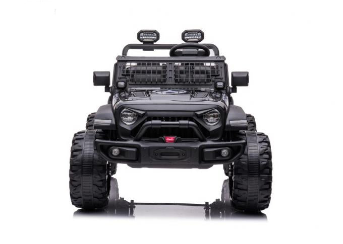 The Black 24V/2WD Xtreme Edition Ride on Truck features Eva wheels, leather seats, a windshield, front bumper, mounted roof lights, and large rugged tires with a grille guard against a white background for an adventurous ride.