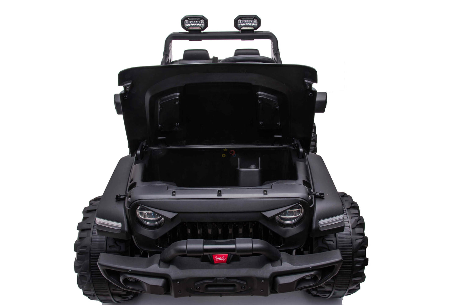 The Black 24V/4WD Xtreme Ride-on Truck features rugged Eva wheels, large tires, leather seats, a roll bar with dual spotlights, and storage under an open hood. Photographed on a plain white background, its the ultimate adventure toy for little explorers.
