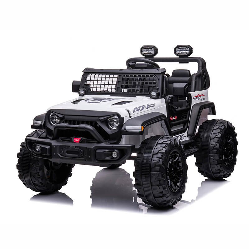 The White 24V/2WD Xtreme Edition Ride on Truck features a black and white design with rugged Eva wheels, leather seats, side mirrors, front headlights, detailed grille, body graphics, and roll bar lights. The 2-seater design mimics an authentic off-road vehicle.