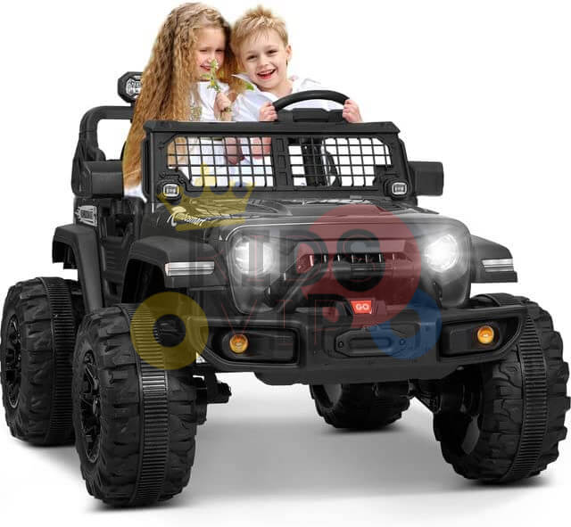 Two children enjoy sitting in a White 24V/4WD Xtreme Ride-on Truck with one holding a flower and the other gripping the wheel. The kids truck, boasting large Eva wheels and leather seats, has its headlights on.