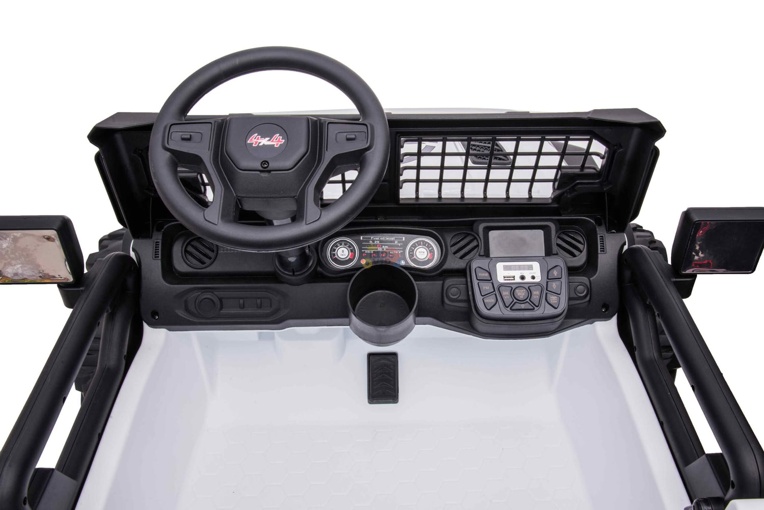 Interior view of the White 24V/4WD Xtreme Ride on Truck dashboard with steering wheel, control buttons, central display, netted panel, dual side mirrors, and a small storage compartment. The 2-seater truck features black and white design with metallic accents. Eva wheels and leather seats included.