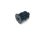 Set against a white background, the 12V 888 Steering Cog is a black, cylindrical plastic component for the 12V 888 ride-on car. It has ridged sides, a central hole, and a metal pin protruding from the bottom.