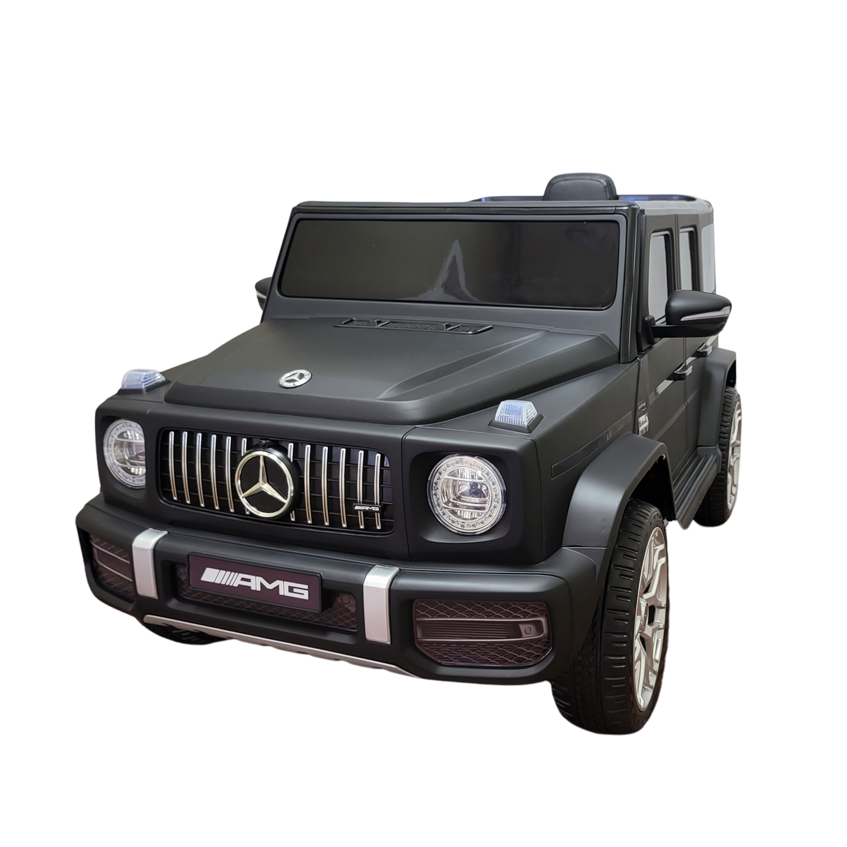 The Limited 12V Matte Edition Mercedes-Benz AMG G63 Ride-On Truck for kids features advanced tech, prominent headlights, a distinct grille with the iconic logo, detailed AMG branding, and meticulous attention to wheels and side mirrors, capturing the SUVs essence.