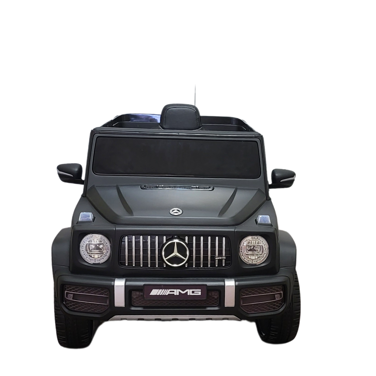 A black Limited 12V Matte Edition Mercedes-Benz AMG G63 ride-on toy truck for kids, featuring detailed headlights, grille, and branding with upgraded technology, is shown from the front on a transparent background.