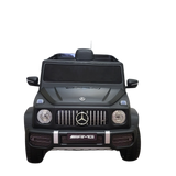 A black Limited 12V Matte Edition Mercedes-Benz AMG G63 ride-on toy truck for kids, featuring detailed headlights, grille, and branding with upgraded technology, is shown from the front on a transparent background.