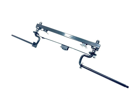 The image shows a 12V Unimog Front Axle with a rectangular central section and two rods on either side against a white background, resembling components in ride-on car assemblies.