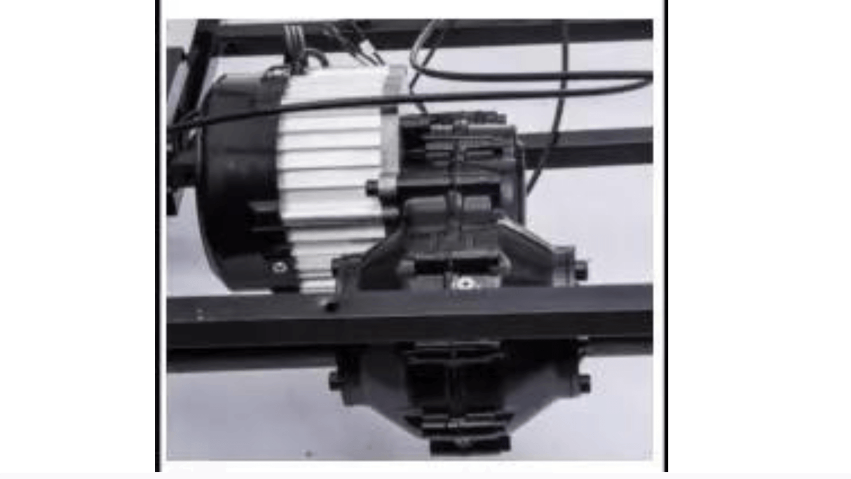 Close-up of a motor and gear system similar to those in the Grey Giant Official Limited Edition Lamborghini SV 24V/180W for Big Kids. The motor has a black and silver casing with wires, mounted on a metal frame, hinting at use in machinery or ride-on models like this one.