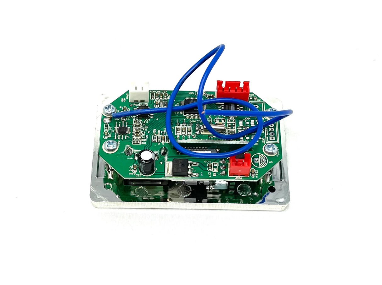 This circuit board, featuring green components and red and white connectors, mirrors the high-quality craftsmanship seen in the 12V Mercedes GLS63 Two Seater Radio at kidsviponline. Blue wires elegantly loop on a rectangular metal base spotted with resistors and capacitors.