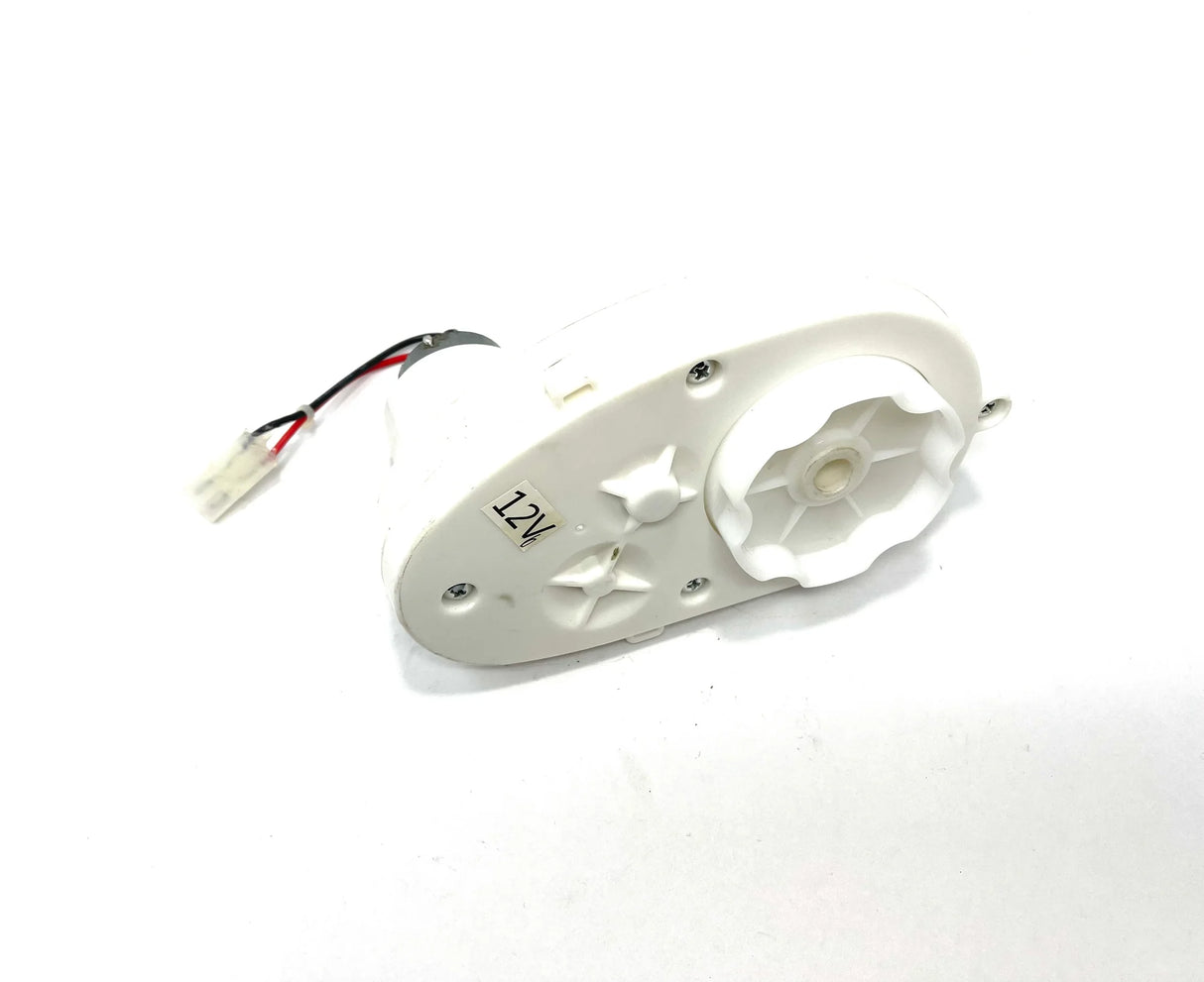 The 12V LaFerrari Gear-Box is a white plastic gear motor with a visible gear, ideal for ride-on car performance restoration. It includes two attached wires with a connector, perfect for gearbox replacement projects, all set against a plain white background.