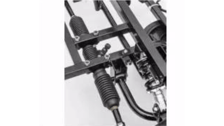 A close-up of a vehicles suspension system showcases sleek black metal rods, springs, and shock absorbers intricately assembled. These components resemble the precision engineering of the Yellow 24V/180W Lamborghini SV Limited XXL Edition ride-on and are mounted on a sturdy frame.