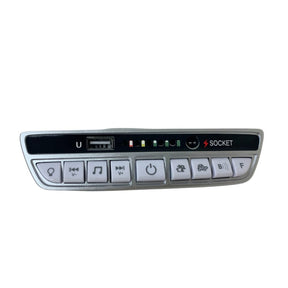 The 12V Mercedes-Benz G63 Soundboard is a sleek silver gadget featuring music control buttons, a USB port, LED indicators, and seamless play/pause/skip/power functions. Perfect for your kidsviponline ride-on car. Socket is labeled near the top right.