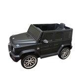 A Limited 12V Matte Edition Mercedes Benz AMG G63 ride-on SUV for kids, in black with silver wheels and detailed grille. The open interior displays upgraded tech, set against a plain backdrop.