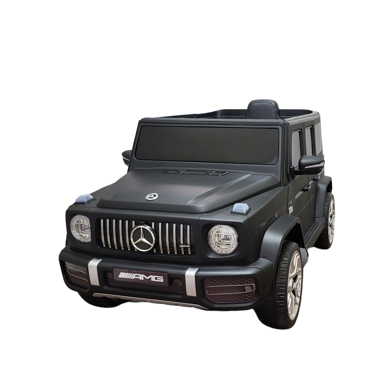 Limited 12V Matte Edition Mercedes-Benz AMG G63 Kids Ride-On Truck, RC, with AMG logo features detailed headlights, grille, silver rims, and black-tinted windows against a solid black background.