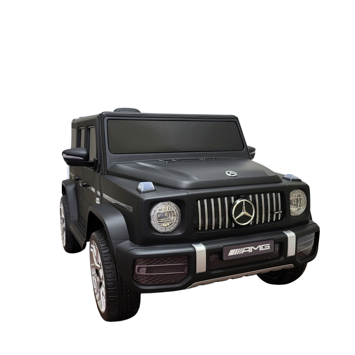 The Limited 12V Matte Edition Mercedes Benz AMG G63 Ride-On for kids and toddlers is depicted with realistic details like front headlights, grille, and logos. Set against a black background, this toy-sized RC truck highlights its sleek design and upgraded technology.