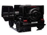 The compact black electric toy car mirrors the XXL Mercedes G63 Kids Ride-On Truck, featuring a spare tire at the back, two open rear doors, detailed wheels, and a shiny surface below. Ideal for young adventurers.