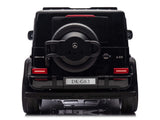 The image displays the rear of a black Mercedes-Benz G-Class SUV, similar to the XXL Mercedes G63 Kids Ride-On featuring a spare tire labeled 4x4², a license plate DK-G63, distinctive tail lights, resembling the Black Mercedes G63 XXL 24V Kids Ride-On Truck – Platinum Edition with MP4 and more.