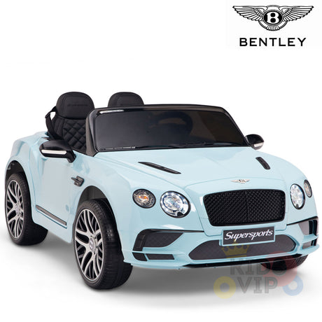 The Blue 12V Bentley GTC ride-on car for kids, with rubber wheels and a remote, showcases black accents, silver rims, two leather seats, detailed front lights, and the iconic Bentley logo.