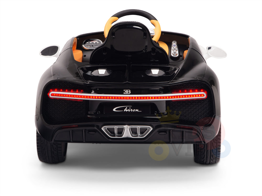 The White 12V Bugatti Chiron Kids Ride On Car offers rubber wheels, red tail lights, and detailed engine vents. With a steering wheel and the Chiron label, this licensed 1-seater embodies luxury in toy form.