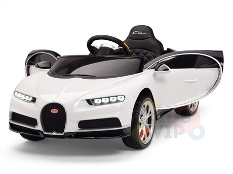 The White 12V Bugatti Chiron Kids Licensed 1 Seater Ride On Car with Rubber Wheels features detailed headlights, an open door, black steering wheel, and quilted black seat. Its sleek aerodynamic design and rubber wheels ensure smooth rides.