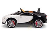 The White 12V Bugatti Chiron Kids Ride On Car with Rubber Wheels and Remote is a licensed, sporty, black-and-white convertible featuring red brake calipers, silver wheels, a visible steering wheel and seat. Its designed for smooth cruising and hours of fun with remote control excitement.