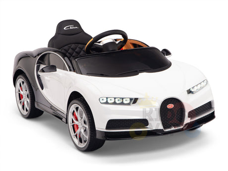 The White 12V Bugatti Chiron Kids Licensed 1 Seater Ride On Car features a detailed interior, steering wheel, rubber wheels with red brake calipers, and comes with a remote control. Its displayed against a plain white backdrop.