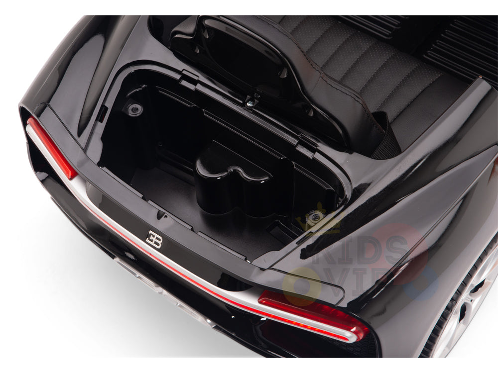 Overhead view of a white 12V Bugatti Chiron Kids Licensed 1 Seater Ride On Car with an open trunk and interior storage, featuring rubber wheels, red rear light detail, and sleek glossy finish—ideal for remote control fun.