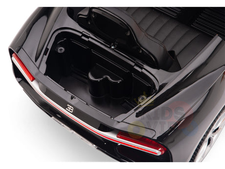 Overhead view of a white 12V Bugatti Chiron Kids Licensed 1 Seater Ride On Car with an open trunk and interior storage, featuring rubber wheels, red rear light detail, and sleek glossy finish—ideal for remote control fun.