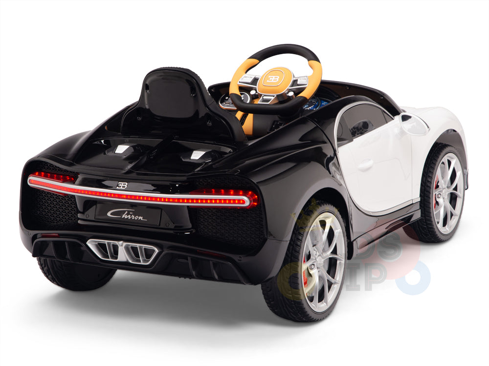 A rear-angle view shows a detailed black and white Bugatti Chiron toy car, featuring realistic taillights, shiny rubber wheels, a steering wheel, and a Chiron license plate. The White 12V Bugatti Chiron Kids Licensed Ride-On Car includes remote control functionality.