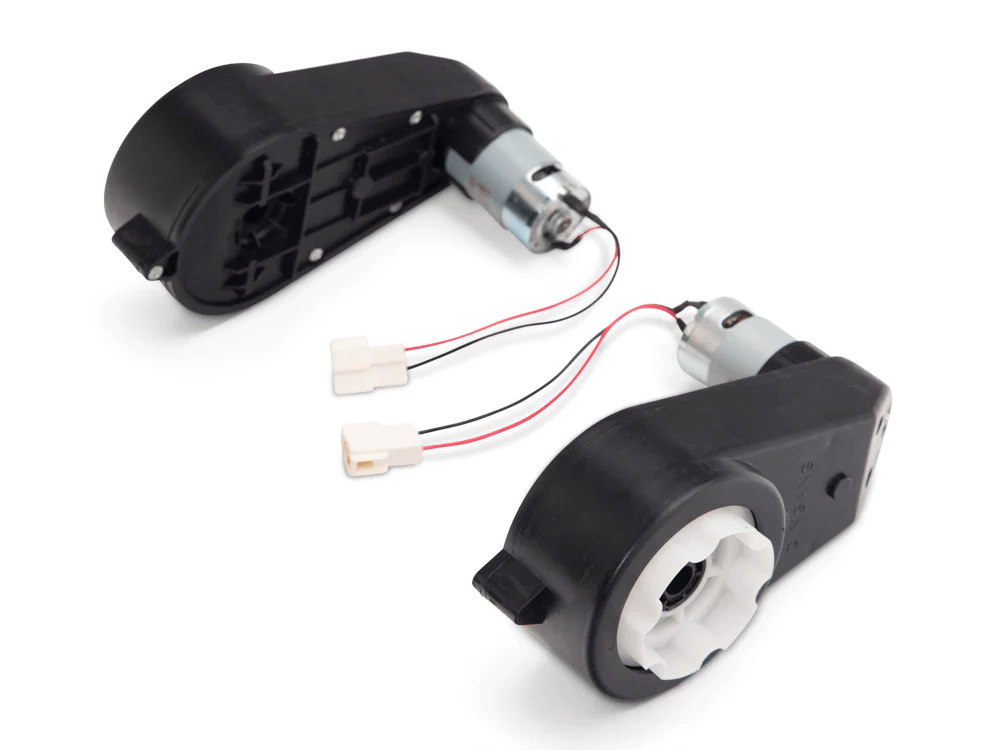 Two black plastic gearboxes with motors and wires, featuring white gears and connectors, are displayed at different angles. They resemble components from the Enhance Your Bugatti Chiron with a High-Quality Set of 12v Motors, likely designed for improved ride-on car performance.