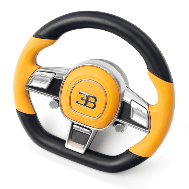 A yellow and black toy steering wheel with a metallic EB embossed center, featuring silver buttons and a textured grip, perfect for upgrading any 12v Bugatti Chiron model with enhanced control and style.