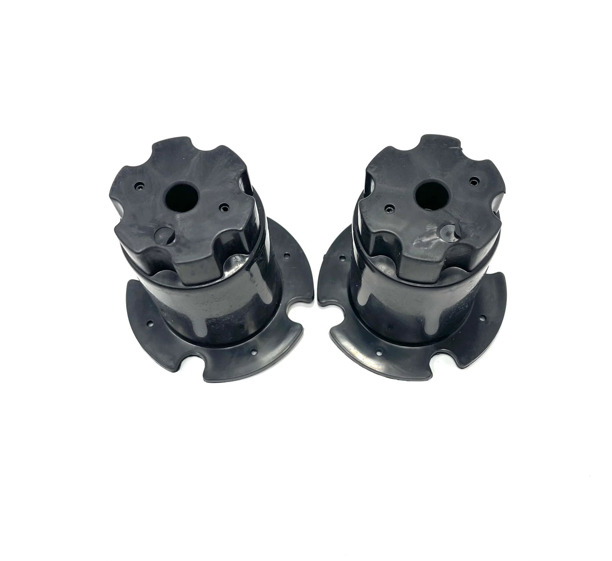 Two 12V 888 wheel cogs, black and cylindrical with round bases and four evenly spaced protrusions on top, are positioned upright side by side against a plain white background.