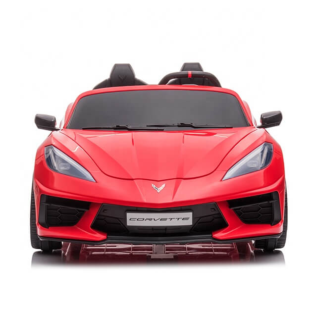 The front view of the Kids Premium 24V Red Corvette C8 Dual-Seater toy car showcases a sleek design with sharp headlights, a central emblem on the hood, and Corvette on the license plate area, featuring EVA wheels and leather seats for an enhanced riding experience.