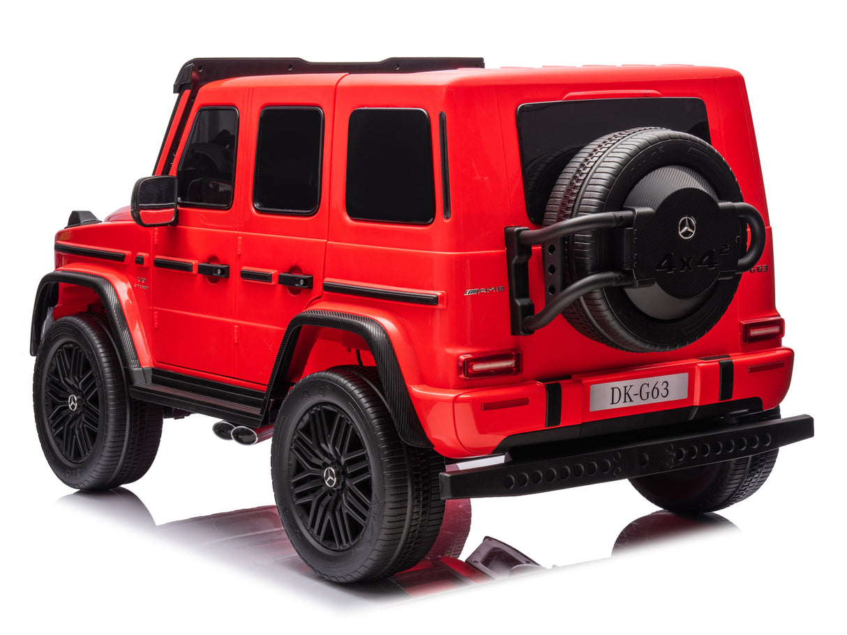 This red 2x24V/4WD Platinum XXL Mercedes G63 Ride-On Truck resembles a luxury vehicle, with black windows, roof, and wheels. It features 4X4 on the spare tire and DK-G63 on the rear plate. Enjoy remote control access for thrilling adventures against a white background.