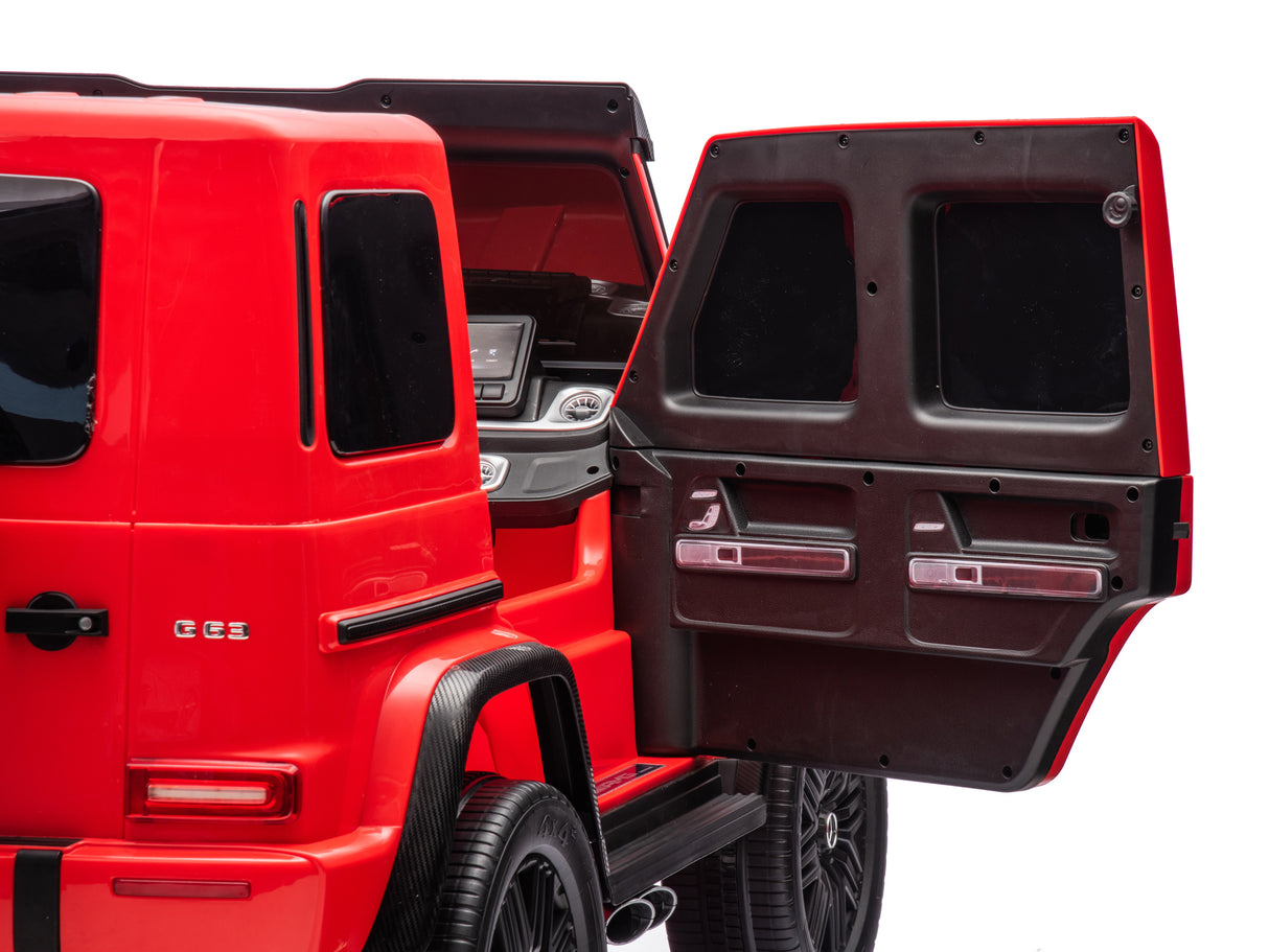 The Red 2x24V/4WD Platinum XXL Mercedes G63 Ride-On Truck showcases a detailed interior dashboard with one rear door open. It resembles a luxury SUV featuring a bold design, remote control access, MP4, EVA wheels, leather seats, and stands against a plain white background.