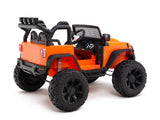 The Orange 24V EVA Big Wheels Kids 1 Seater Upgraded Ride On Truck features off-road styling with large black rubber wheels and a sleek black interior. It has a steering wheel, detailed dashboard, roll bars, and remote control for toddlers. Displayed from a rear-side angle.