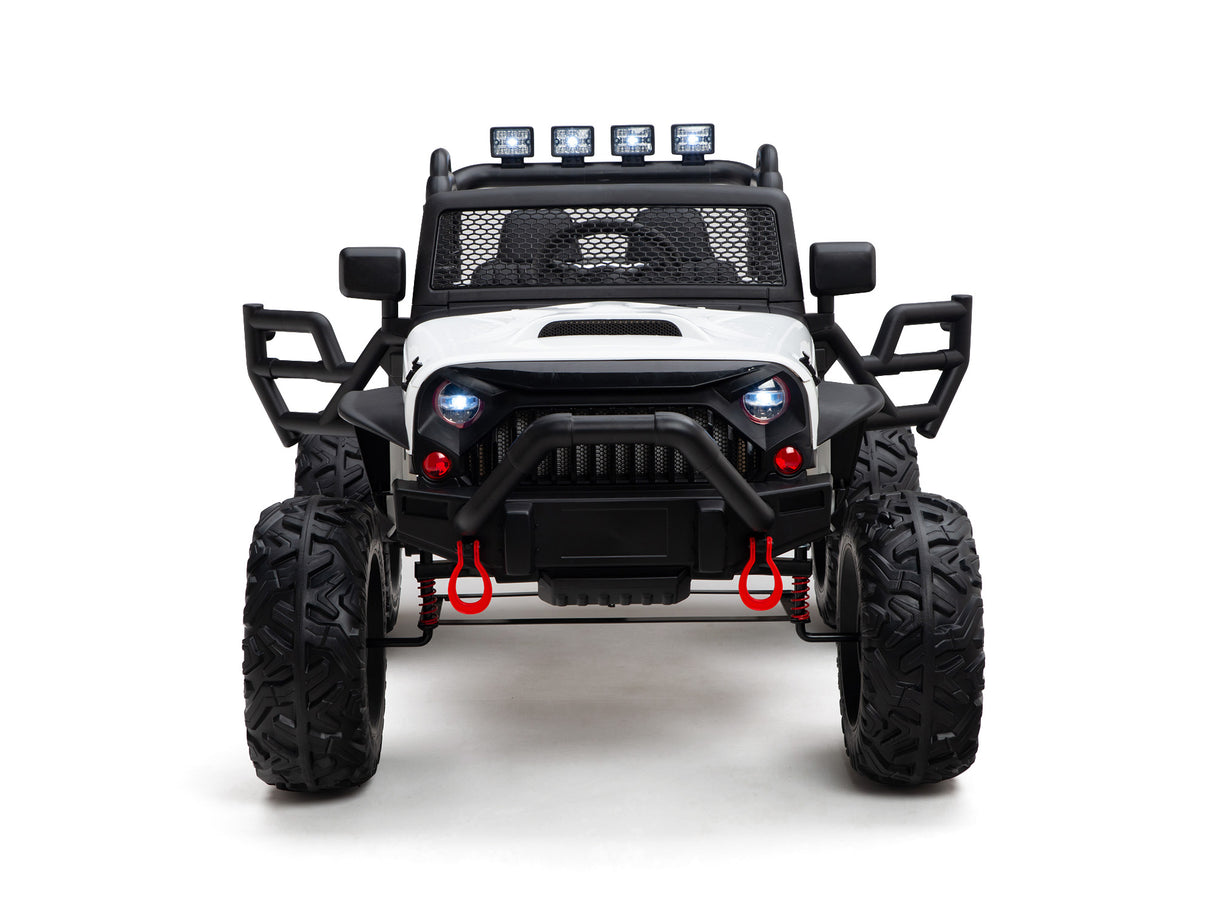 Front view of the White 24V EVA Kids Ride-On Truck features big rubber wheels, a black grill, four rooftop spotlights, red tow hooks, protective side bars, and leather seats. It offers a rugged design powered by a 24V battery.