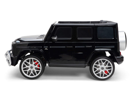 The Black 24V/4x4 Official Mercedes Benz G63 Ride On Car with RC features a detailed design, large silver wheels, and red brake calipers. Its shiny finish pops against the white background, mimicking a luxury SUV for kids.