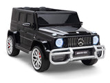 The Black 24V Mercedes-Benz G63 Ride-On Car for kids features a powerful battery, chrome accents, LED headlights, and a detailed grille. It sports four large white wheels with red brake calipers, enhancing its sporty allure.