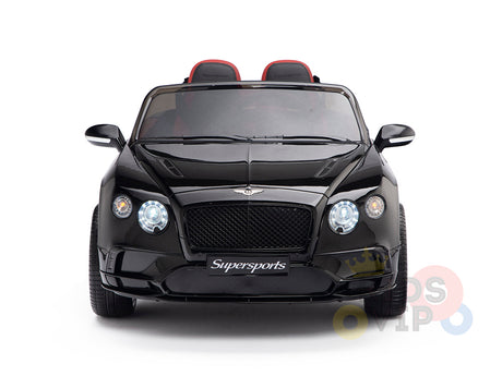 Front view of the black 12V Bentley GTC Kids Licensed Ride On Car showcasing its sleek design, rubber wheels, two seats with headrests, prominent headlights, and Supersports elegantly on the grille.