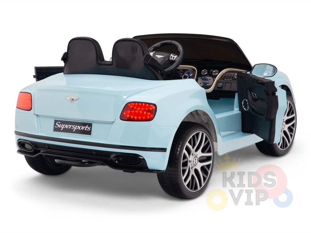 The Blue 12V Bentley GTC Kids Licensed Ride-On Car features rubber wheels, a remote, black leather seats, an open driver-side door, visible interior details, red taillights, Supersports branding on the back, and the Kids VIP logo highlighting its remote control features.