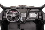 The Pink 2x24V/2WD Official Can-Am Maverick Ride on Buggy, LX Performance features a modern interior with a steering wheel, dashboard, digital display, and control buttons designed for a utilitarian feel reminiscent of a Dakar champions ride. The speedometer reads 60 with numerous buttons and knobs nearby.