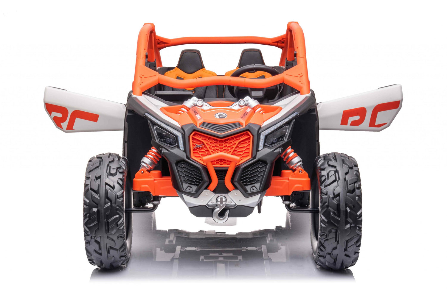 The Official Can-Am Maverick Ride-on Buggy, LX Performance, in orange, mirrors the real thing with large rugged wheels and open sides. It boasts a sporty design with a roll cage and visible suspension springs, complete with RC panels and Eco Leather Seats.