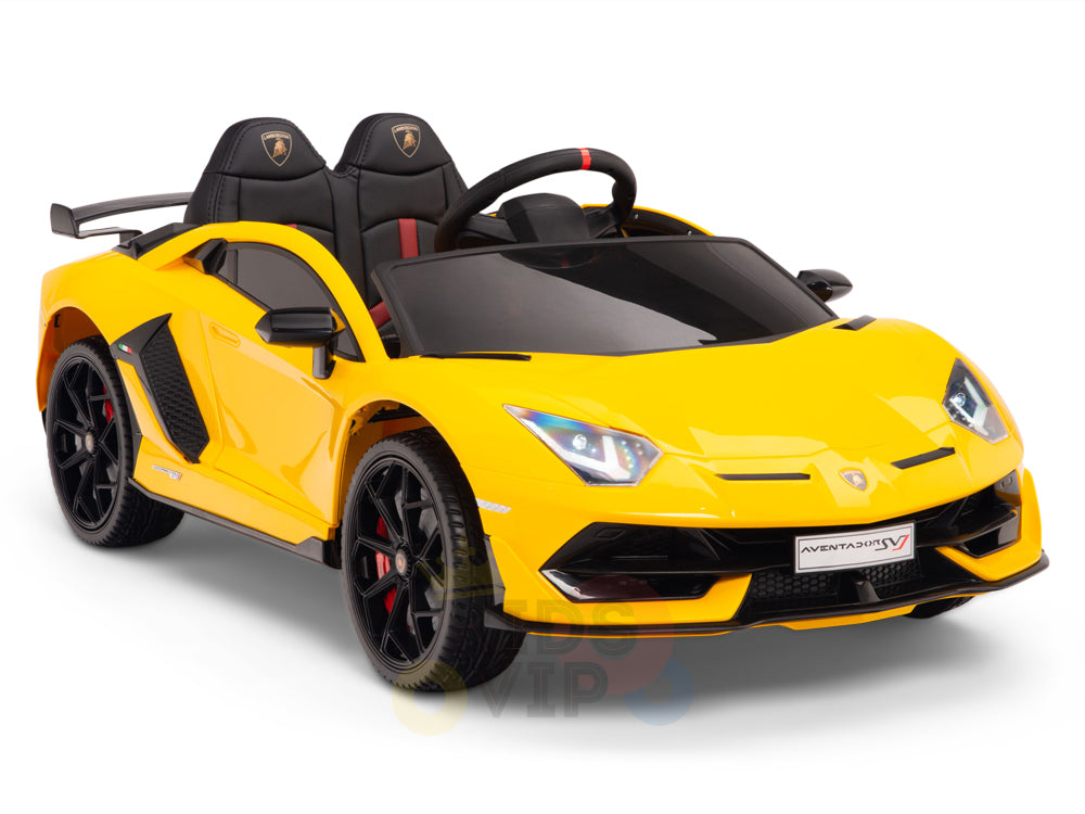 The Yellow 12V Lamborghini SVJ Sport Kids Licensed Ride-On Car features black seats, red accents, a sleek angular design, realistic details like a spoiler and side mirrors, and branding on the front. Its perfect for children who love luxury ride-on cars.