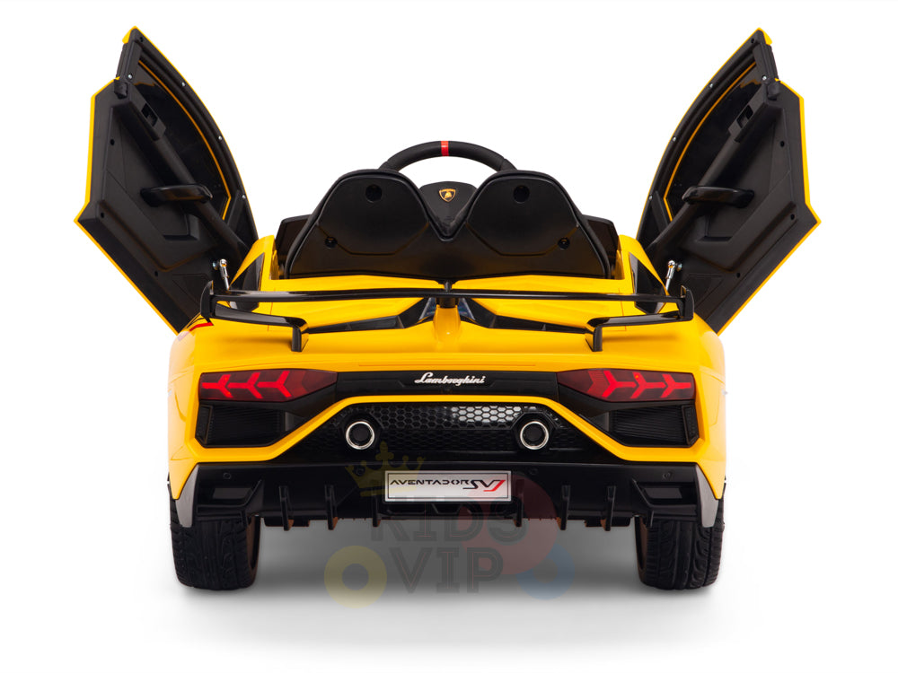 This yellow licensed 12V Lamborghini SVJ Sport Kids Ride On Car features black accents, open scissor doors, visible logo, taillights, and dual exhausts. The license plate reads Aventador SV, echoing the iconic Lamborghini SVJ design.