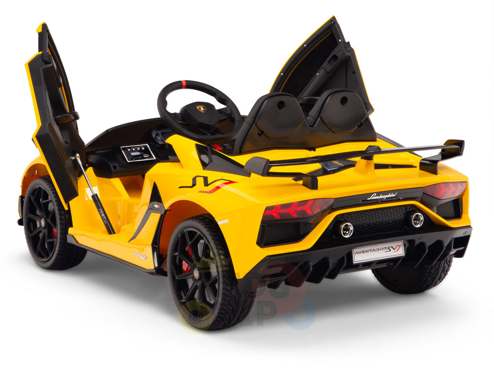 A yellow 12V Lamborghini SVJ one-seater ride-on car features a licensed design with open scissor doors, black interior, and red accents. Showcased on a white background, it highlights the detailed rear and includes remote-controlled rubber wheels.