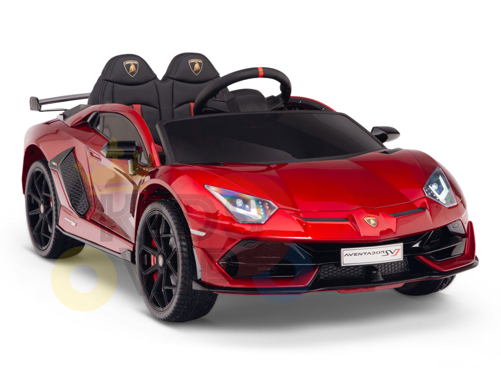 The Burgundy Red 12V Lamborghini SVJ Sport Kids Licensed Ride On Car features a sleek sports car design with rubber wheels, a detailed interior, and is powered by a 12V battery. It includes one seat, a steering wheel, operating headlights, and a rear spoiler.