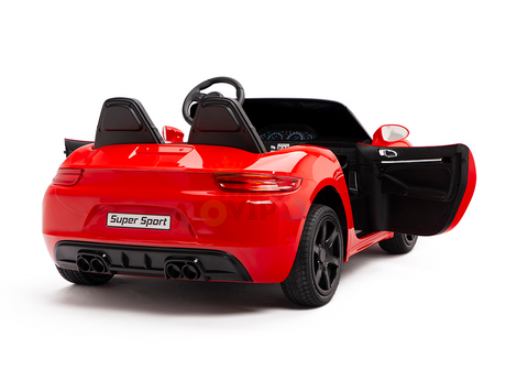 A Red 24V XXL SuperSport Big Kids Ride On Car with a 180W brushless motor features two seats, a steering wheel, an open drivers side door, visible interior dashboard, black wheels, and rear exhausts—ideal for adventurous kids who love zooming around!.