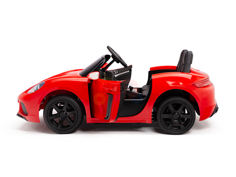 A side view of the Red 24V XXL SuperSport Big Kids Ride On Car with black wheels and an open drivers door. This sleek car, featuring a steering wheel and black seat, offers an exciting ride for children with its 180W brushless motor and real tires.